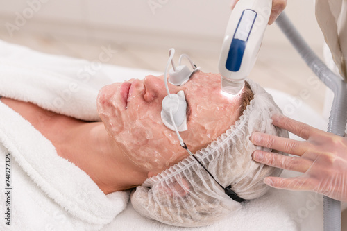 Obraz na plátně Anti acne phototherapy with professional equipment