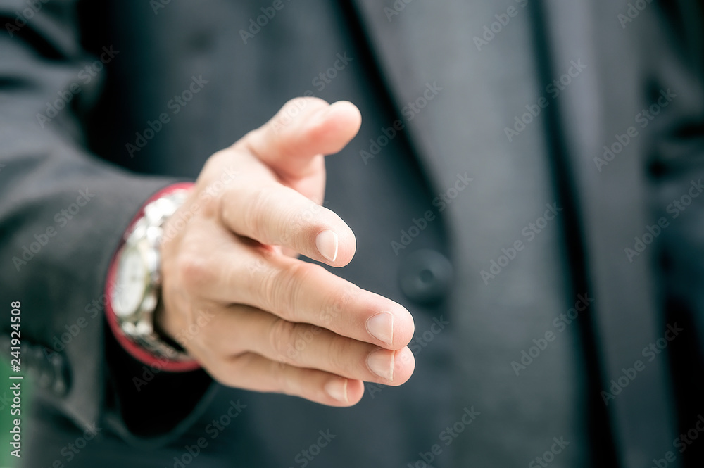 Closeup businessmen shaking hands.