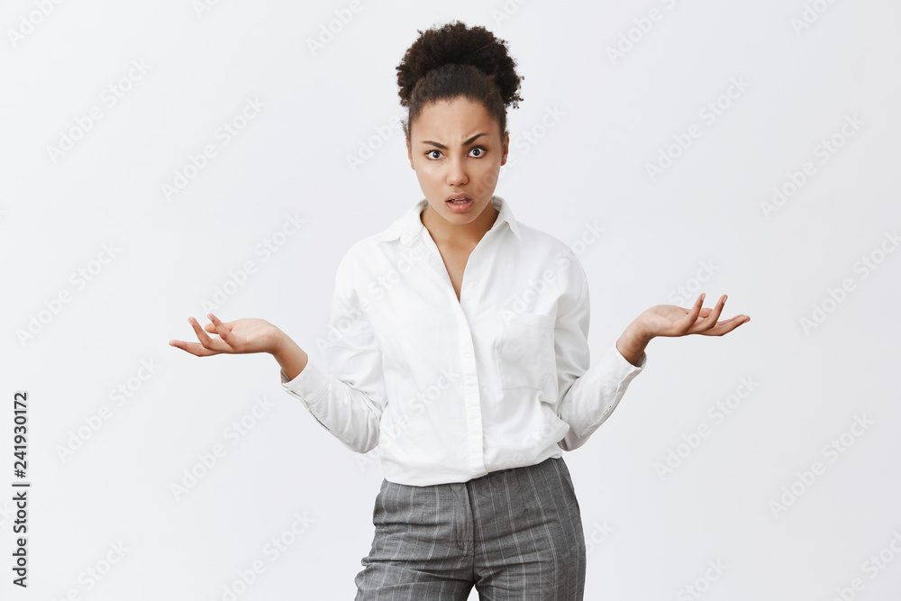 Boss displeased, seeing work have not started. Pissed and confused good-looking successful female office manager in white collar shirt and pants, spreading palm in clueless gesture, staring at camera Boss displeased, seeing work have not started. Pissed and confused good-looking successful female office manager in white collar shirt and pants, spreading palm in clueless gesture, staring at camera