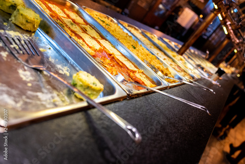 Obraz na plátně Trays with pasta dishes for self-service buffet in a restaurant.