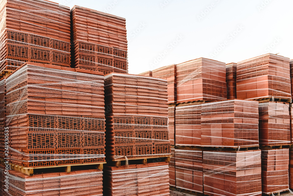 Brick pallets ready to build buildings by bricklayers.