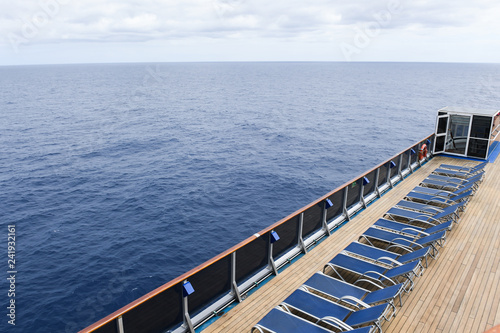 Wallpaper Mural Lounge chairs on a ships deck with the ocean in the background. Torontodigital.ca