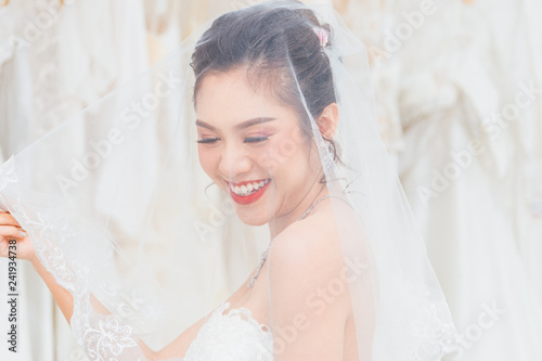 Thai Bride Girl Smiling while attached vail with head