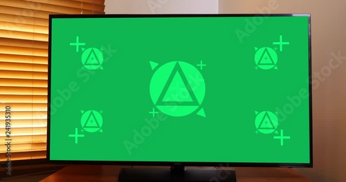 A slow dolly shot of a typical home flatscreen television. Green screen with optional tracking points for screen replacement. Pre-tracked AE comp available upon request.  	