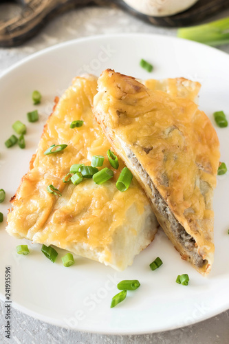 Béchamel baked pancakes stuffed with mushrooms