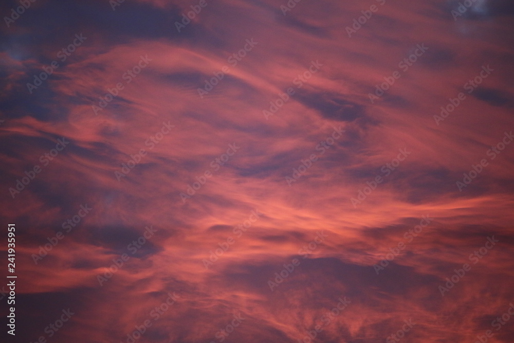 dramatic sky with reddish clouds