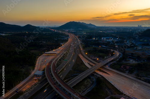 Aerial view. Highway intersections and traffic at twilight