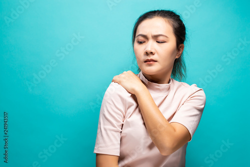 Tired woman has pain in shoulder
