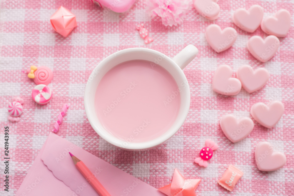 Valentine's day holiday celebration with cup of milk on pink tablecloth and Valentine composition. Valentine's day holiday celebration with cup of milk on pink tablecloth and Valentine composition.