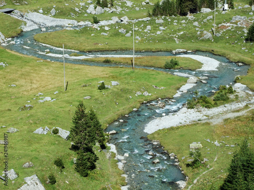 The Fatschbach stream in the beautiful Alpine valley Urner Boden - Canton of Uri, Switzerland photo