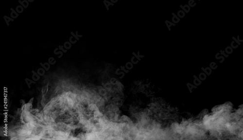 Fog and mist effect on isolated black background for text or space 
