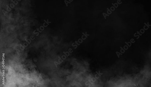 Smoke on the floor . Isolated black background. © Victor