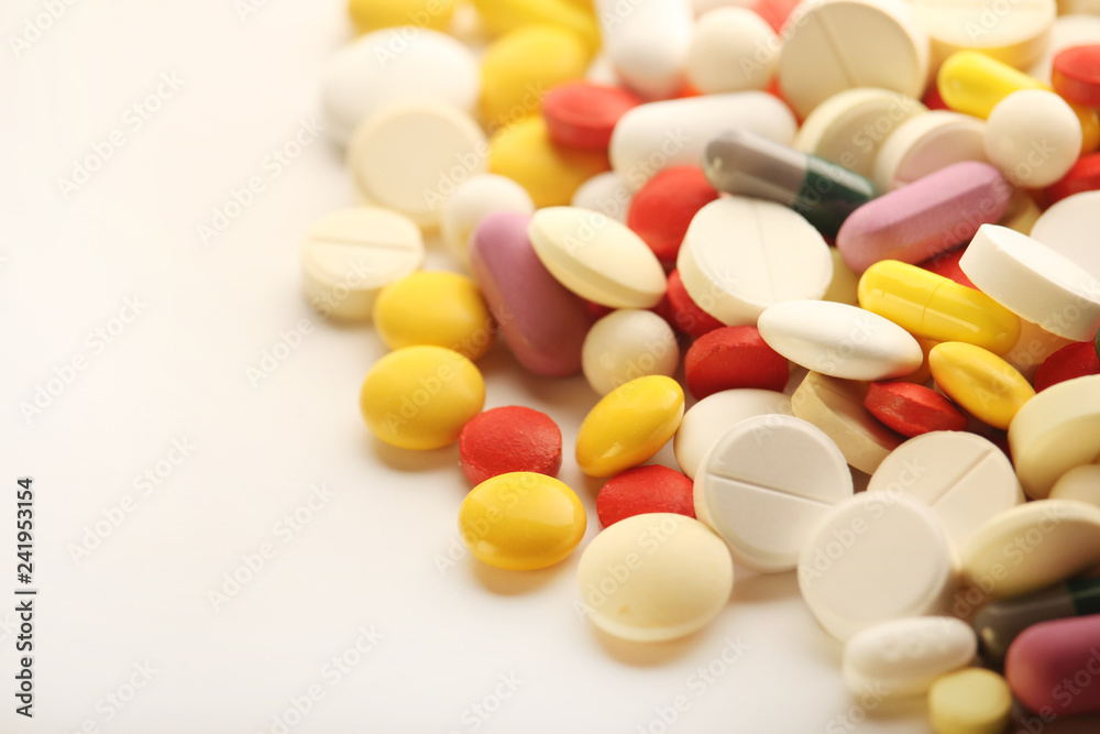Different colorful tablets at white background Different colorful tablets at white background