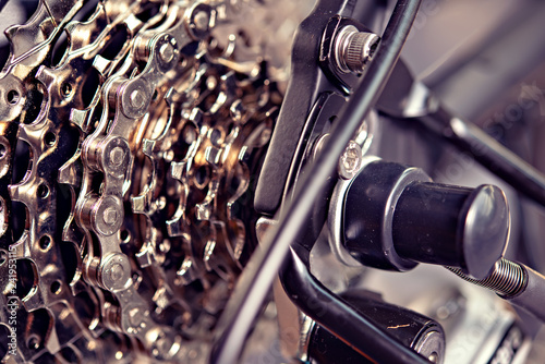 close up of  bicycle gear and black electric motor