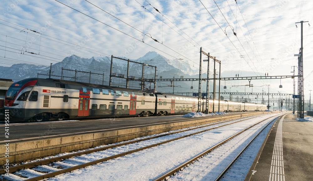 January 4, 2019 - Sargans, SG, Switzerland: train station in Sargans, Switzerland, in winter after clean up work with a modern SBB train departing the station on time