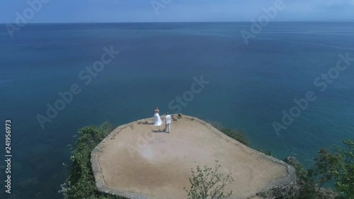 Aerial view from drone of wedding couple at the cliff