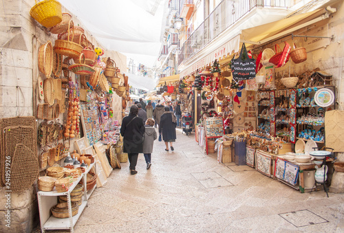 View of a narrow street in  Bari, Puglia, Italy, Bari vecchia, traditional open market shops with souvenir for tourists photo