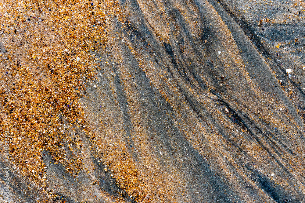 The light plays on the sand of a beach in northern Brittany The light plays on the sand of a beach in northern Brittany