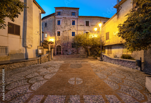 Castel di Tora (Italy) - An awesome mountain and medieval little town on the rock in Turano lake, province of Rieti, Lazio region. Here a view of historical center. photo