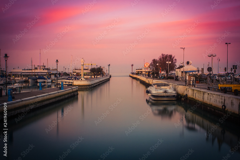 Fototapeta premium View of the Port at sunset. Long exposure picture in Riccione, Emilia Romagna, Italy.