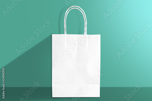 green shopping bag isolated on green background