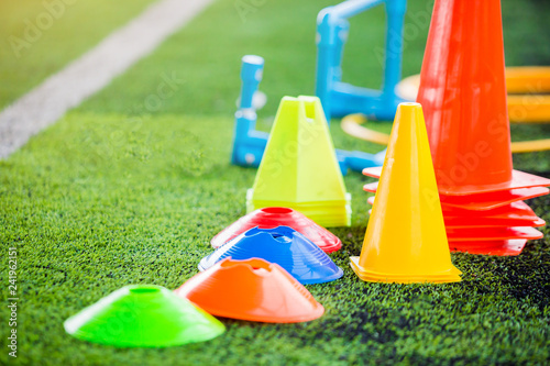 Fototapeta Naklejka Na Ścianę i Meble -  soccer training equipment on green artificial turf