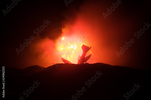 Air Crash. Burning falling plane. The plane crashed to the ground. Decorated with toy at dark fire background. Air accident concept.