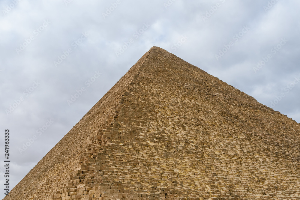 The great pyramid of Cheops in Giza plateau. Cairo, Egypt The great pyramid of Cheops in Giza plateau. Cairo, Egypt