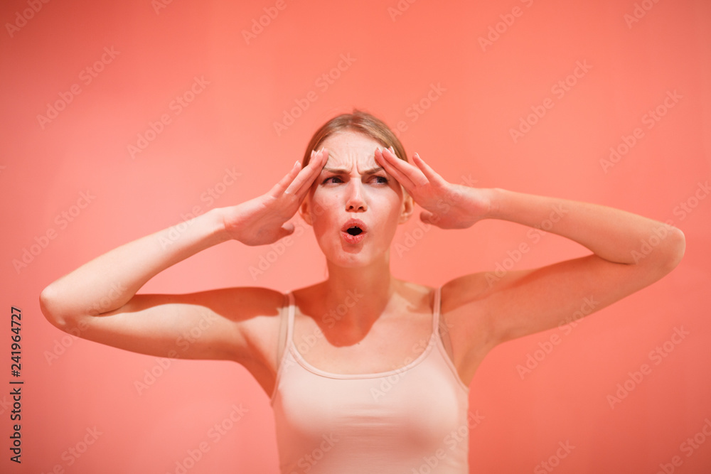 Portrait of a young European woman. She peers intensely into the distance. Her eyes and mouth are wide open. Portrait of a young European woman. She peers intensely into the distance. Her eyes and mouth are wide open.