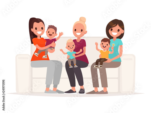 Moms are holding babies in their arms while sitting on the sofa. Communication of young mothers