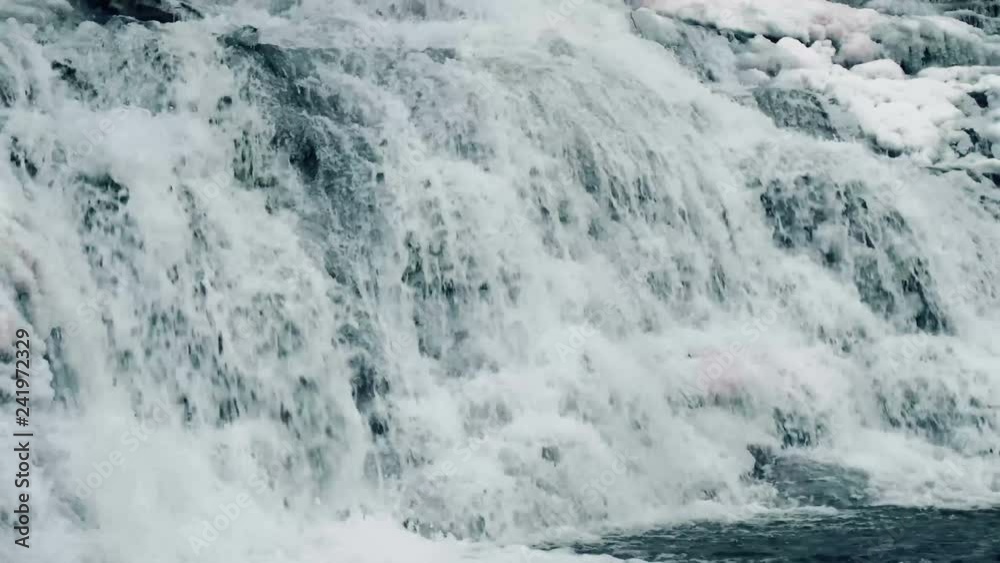 Nice waterfall in winter time with ice. Slow motion nature footage. Nice waterfall in winter time with ice. Slow motion nature footage.