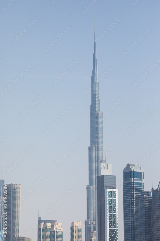 Beautiful architectural background. Panoramic view of Dubai's business bay at sunset.