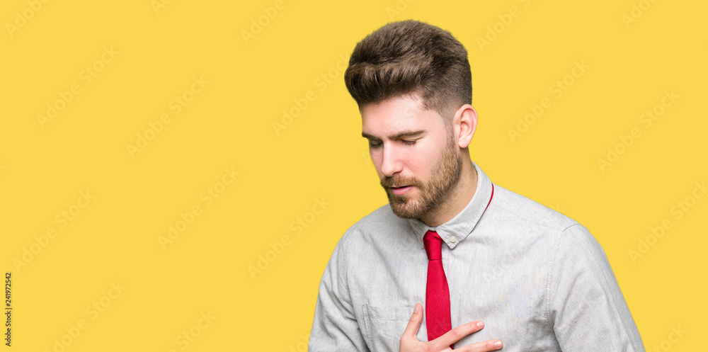 Young handsome business man with hand on stomach because indigestion, painful illness feeling unwell. Ache concept. Young handsome business man with hand on stomach because indigestion, painful illness feeling unwell. Ache concept.