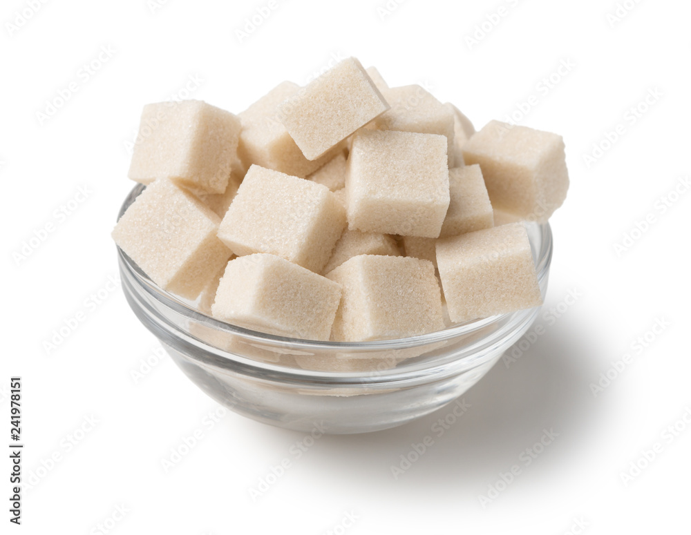 Refined sugar in glass bowl on white background Refined sugar in glass bowl on white background