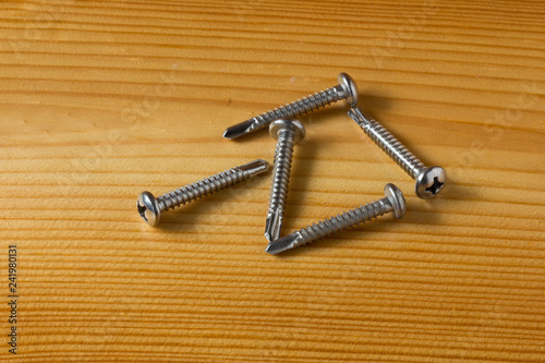 Steel Self-Drilling Screws Flat Head on wooden board