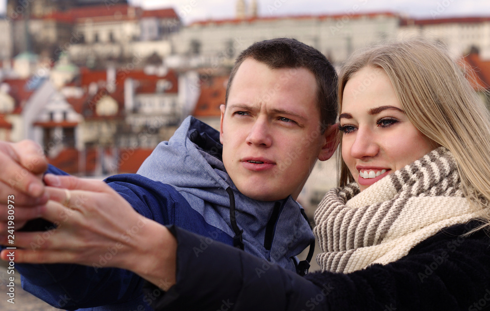Prague, Czech Republic December 23, 2018 - Young couple in love spend time with each other in the center of Prague