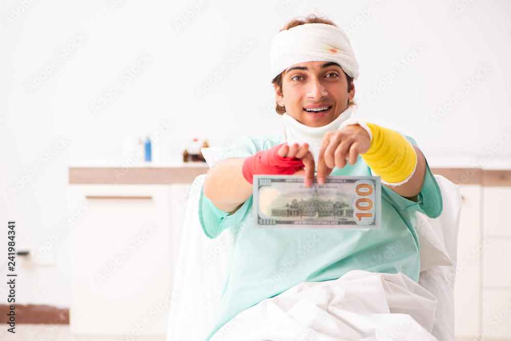 Young injured man staying in the hospital Young injured man staying in the hospital