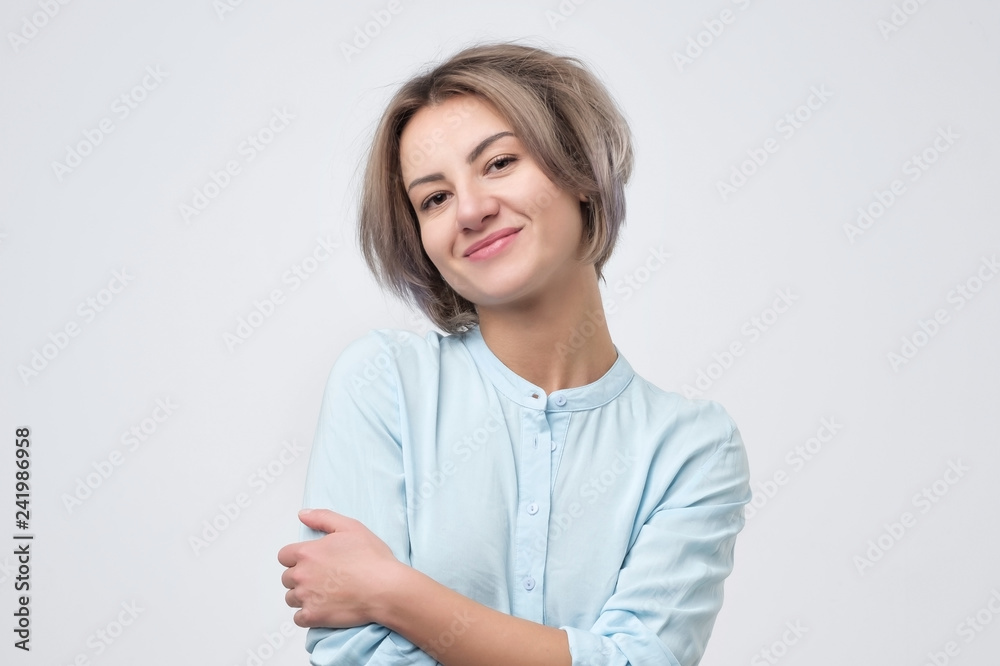 Woman with short fair hair being very glad smiling with broad smile Photos  | Adobe Stock