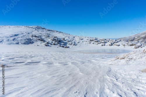 Winter landscape in a sunny day on the snow covered Velouchi mountain in Greece
