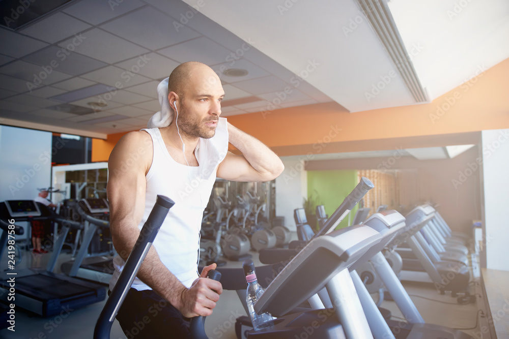 Fototapeta premium Man doing cardio training on treadmill