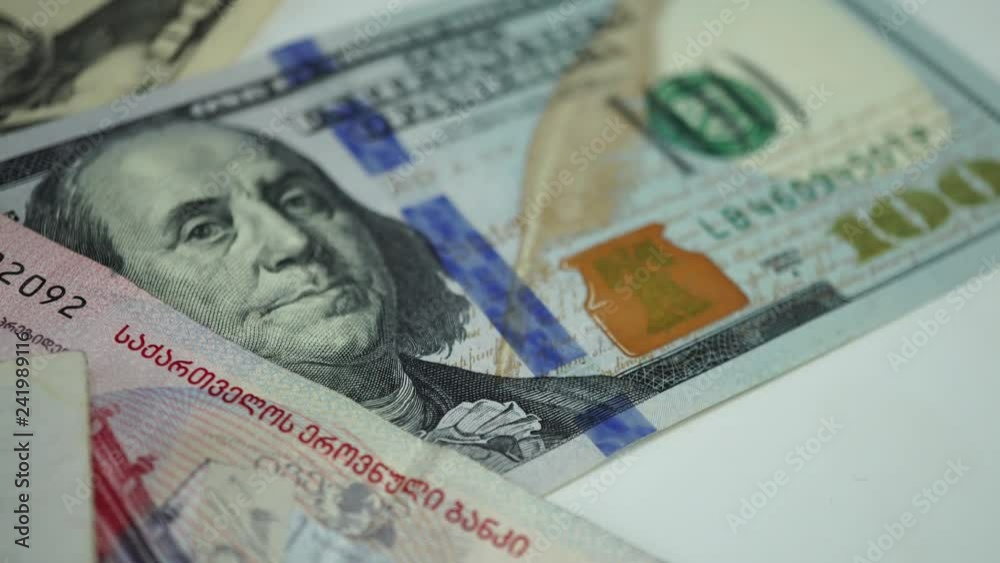 Georgian money and dollars on rotating table. 4K Georgian money and dollars on rotating table. 4K