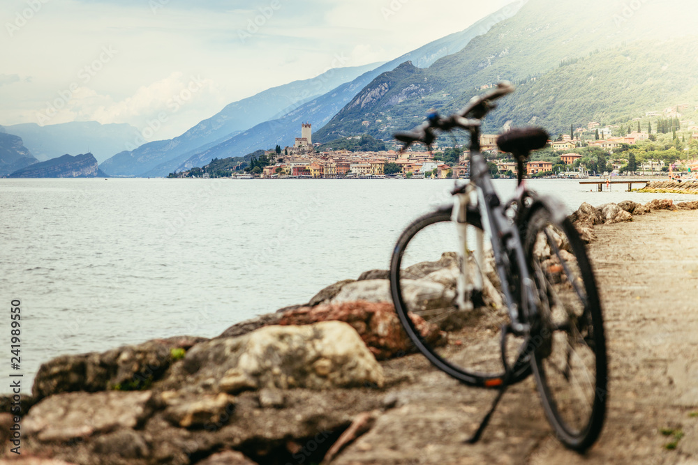 Mountain biking in the holidays: Landscape with lake and village Mountain biking in the holidays: Landscape with lake and village