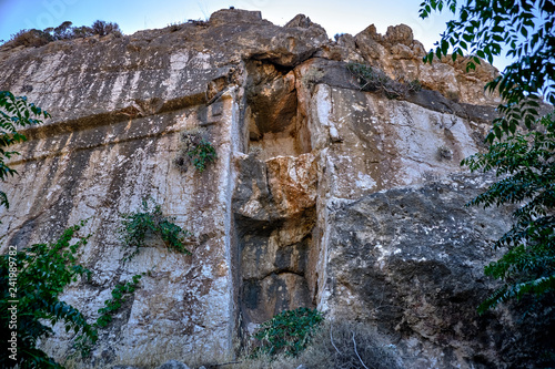 Ancient rock in the port on the island of Rhodes photo