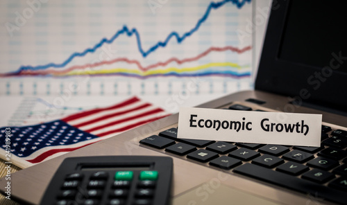 Economic Growth still life business finance concept with laptop, stock chart, shallow DOF