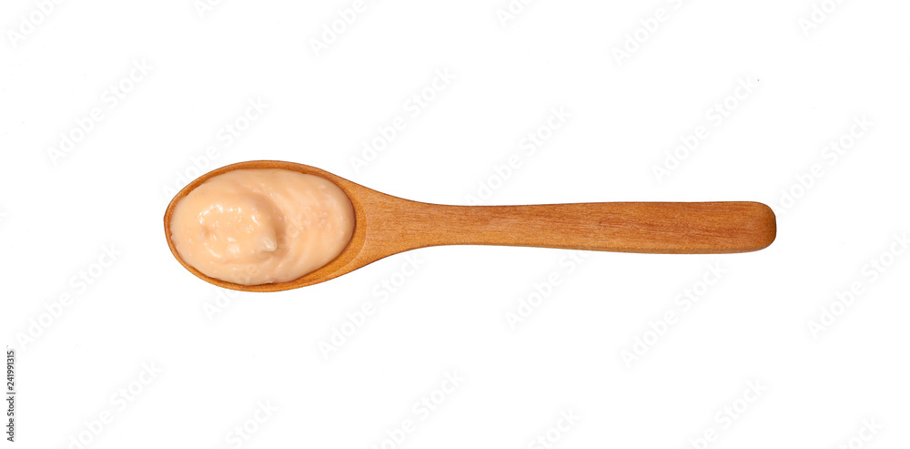 Shrimp sauce in small wooden spoon isolated on white background,top view Shrimp sauce in small wooden spoon isolated on white background,top view