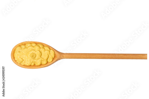 Mustard sauce in small wooden spoon isolated on white background,top view