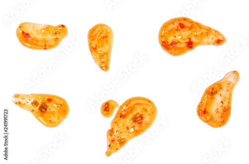 Splashes and stains sweet chili sauce  isolated on white background.Top view