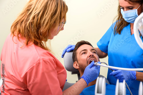 A patient getting treatment in a dental studio 