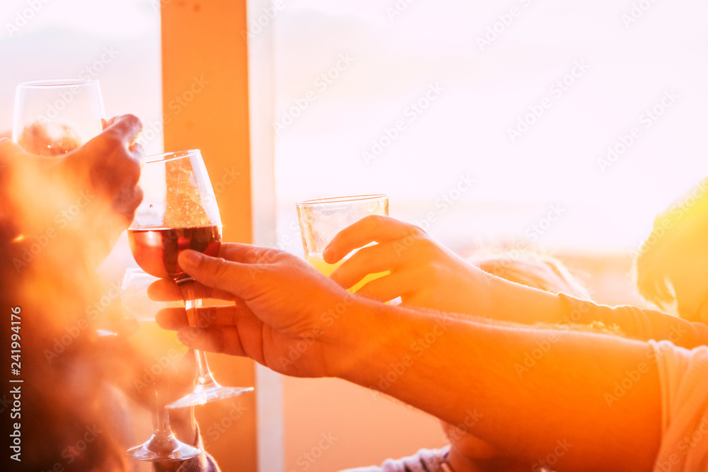 Φωτογραφία Close up of group of friends toasting and clinking glasses with beer and wine al