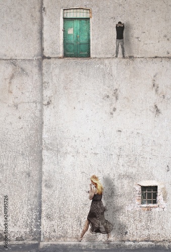 Surreal urban landscape with figures of young woman and man.